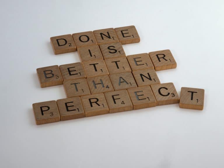 done is better than perfect in scrabble pieces - taking action in a website VIP day will take your business to the next level - take that messy action!